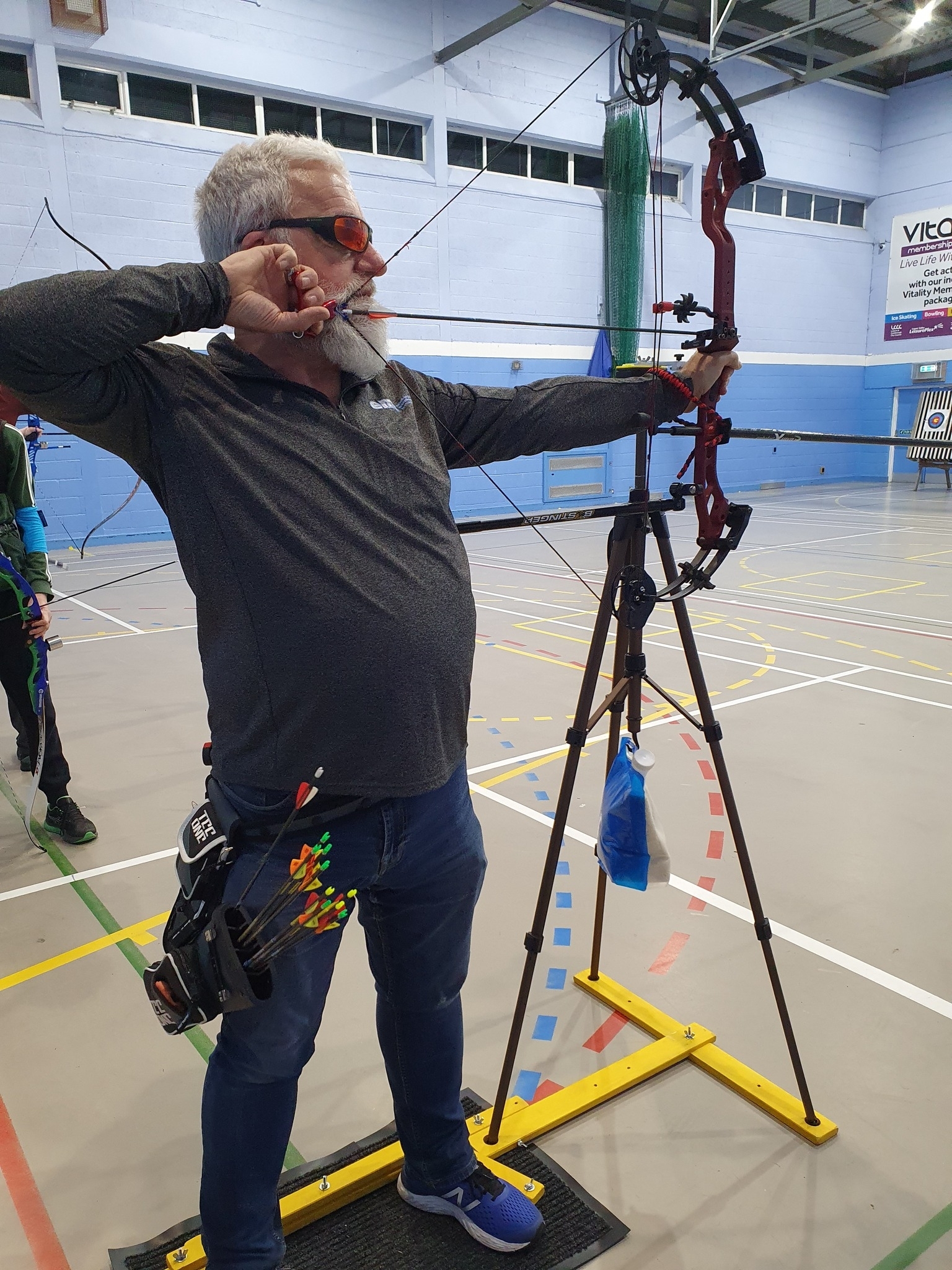 Tony Barclay shooting a bow